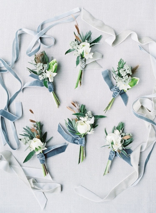 blue and grey winter wedding boutonnieres with dusky blue velvet ribbons