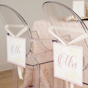 Clear Wedding Chairs with Mr and Mrs Signs