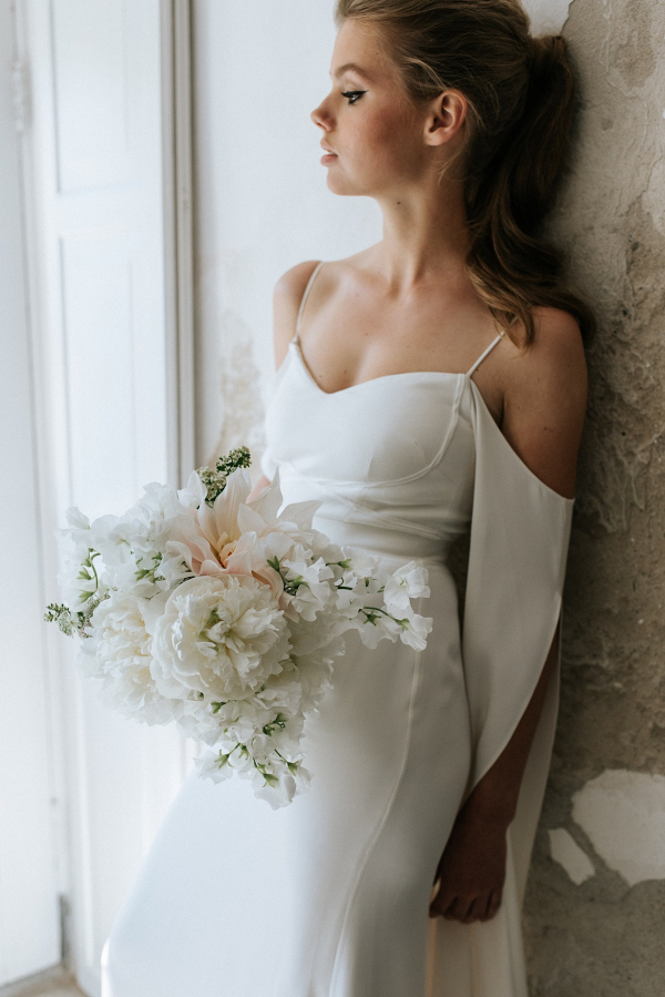 Bride with white bouquet on Bridal Musings