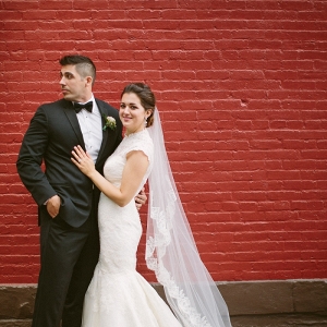 Gorgeous Bride Groom Stealing Moment Wedded Bliss Red Brick Wall
