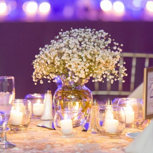 Romantic Uplighting, Tons of Candles, and Floral Centerpieces Set the Scene at This Glamorous Winter Wedding
