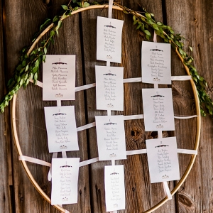 Wooden Embroidery Hoops and Fresh Greenery Make for a Darling Seating Chart Display at This Pumpin Inspired Fall Farm Wedding
