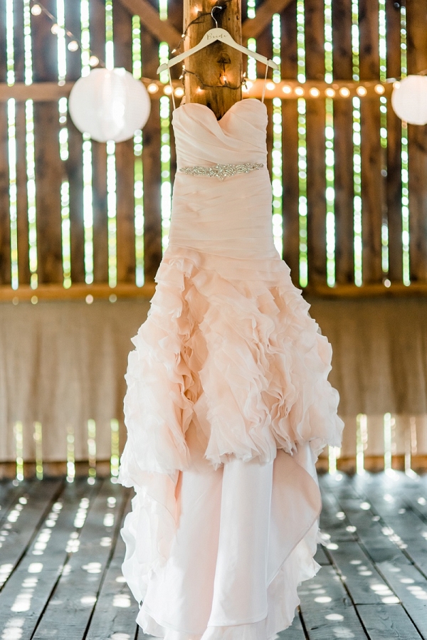 Ruffles, a Sweetheart Neckline, and a Beaded Belt Decorate this Blush Pink Wedding Dress