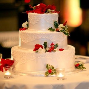 Three Tier Buttercream Wedding Cake Holly Votive Candles Sparkly Christmas Wedding