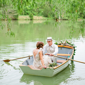 Bride and groom in rowboat 