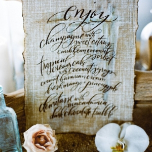 Calligraphy wedding menu on linen