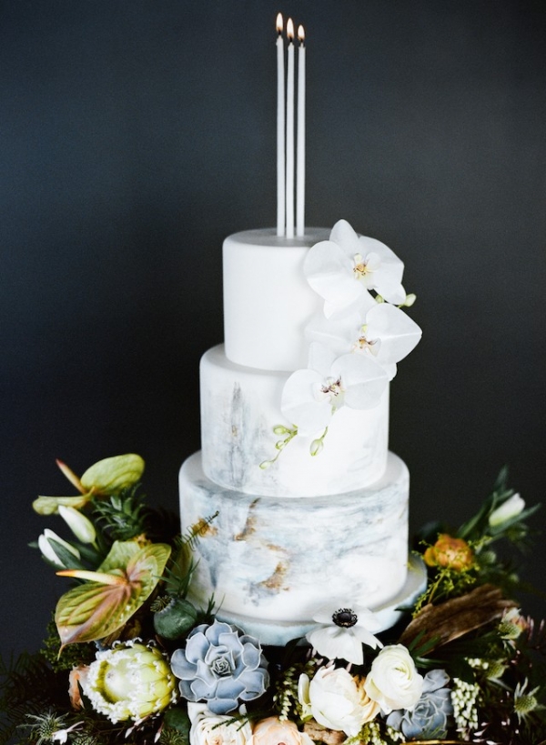Painted wedding cake with candle cake topper