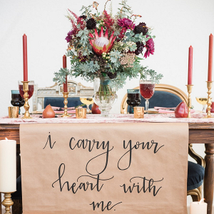 Sweetheart table with calligraphy quote
