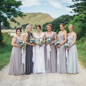 Bridesmaids in mis-matched gray dresses on Chic Vintage Brides