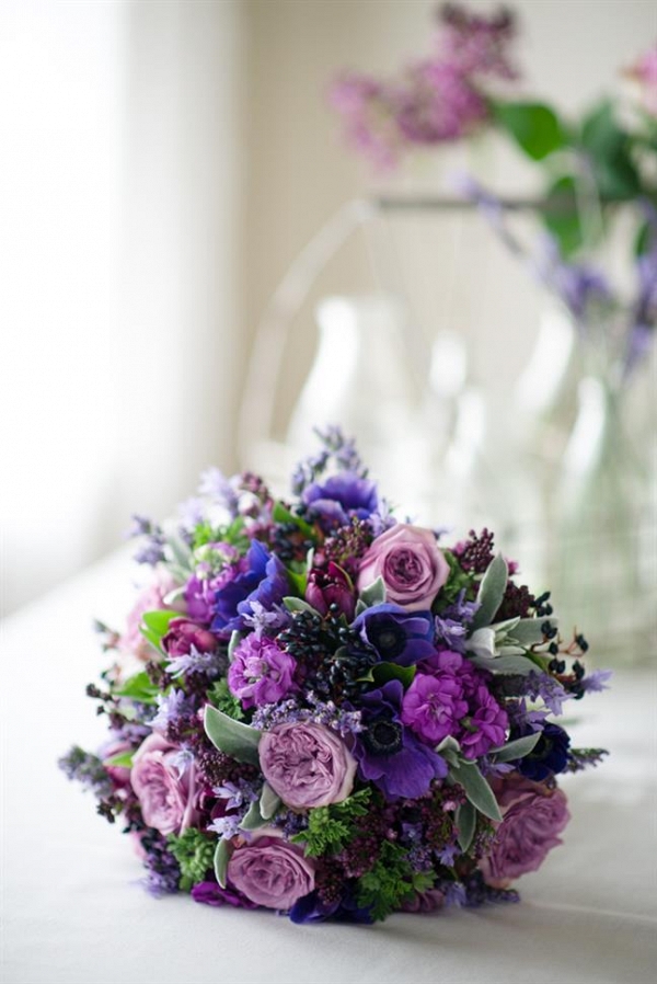 A Hand-Tied Bridal Bouquet of Purple Spring Blooms