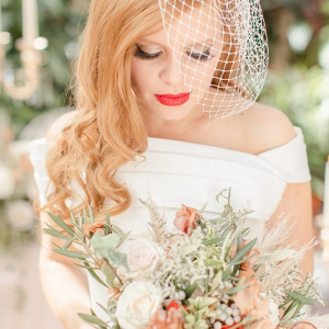 Bride with birdcage veil and red lip
