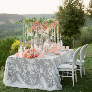 Wedding table with suspended flower and candle centerpiece