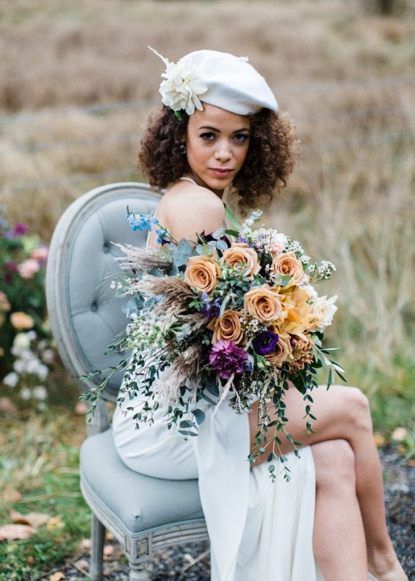 Bride with beret and colorful bouquet