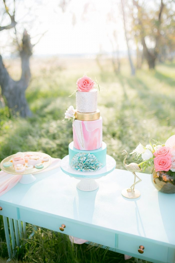Pink, turquoise, and gold wedding cake