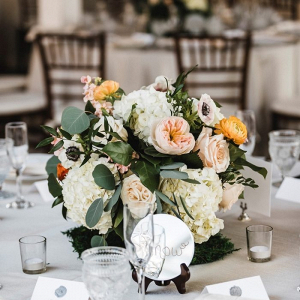 Peach and yellow floral wedding centerpiece