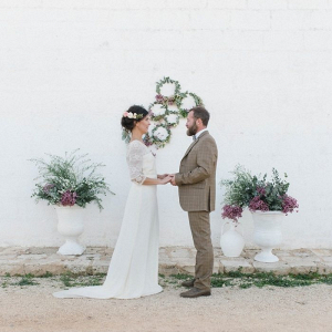 Ceremony with floral hoop backdrop