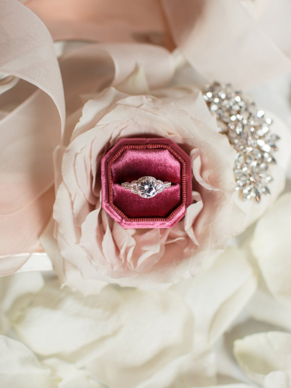 elegant wedding diamond ring in red heart jewelry box on beautiful pink  rose petal background close up Stock Photo | Adobe Stock