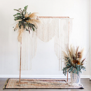 Copper pipe and macrame wedding ceremony backdrop