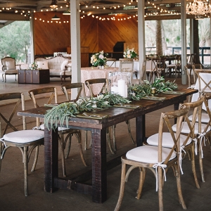 Rustic Farm Tables With Greenery And String Lights