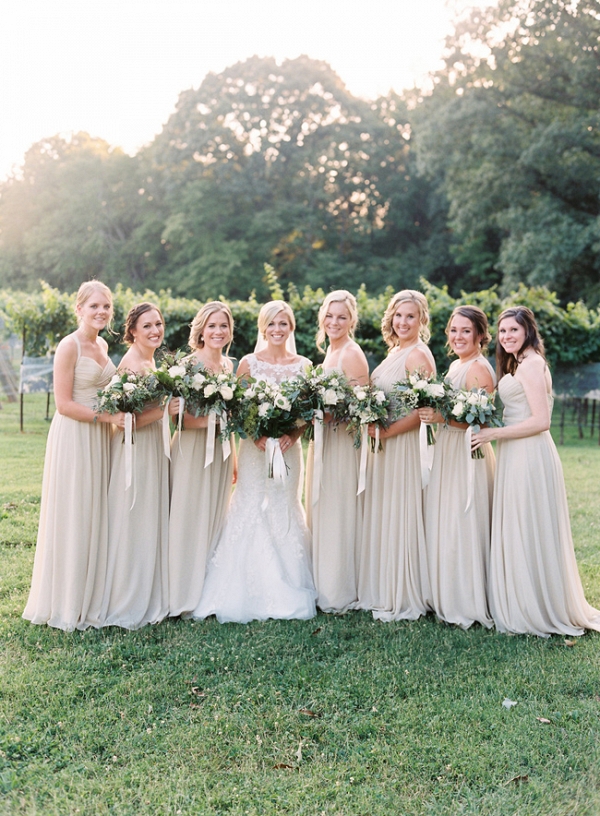 Bridesmaids In Ivory With Greenery Bouquets