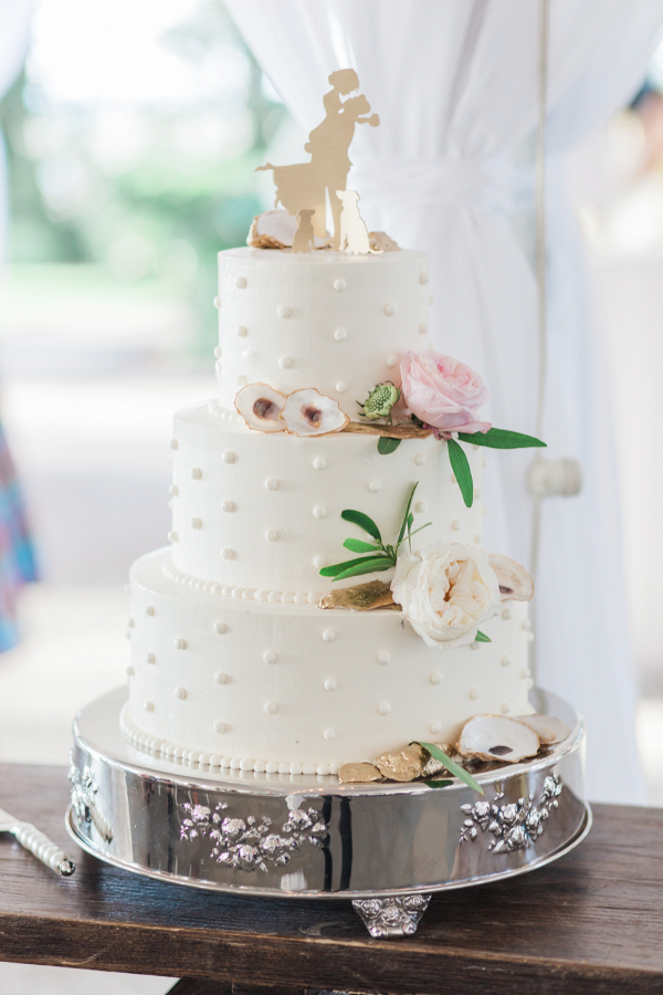 White wedding cake with oyster shells