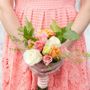 Coral dress and bouquet close up