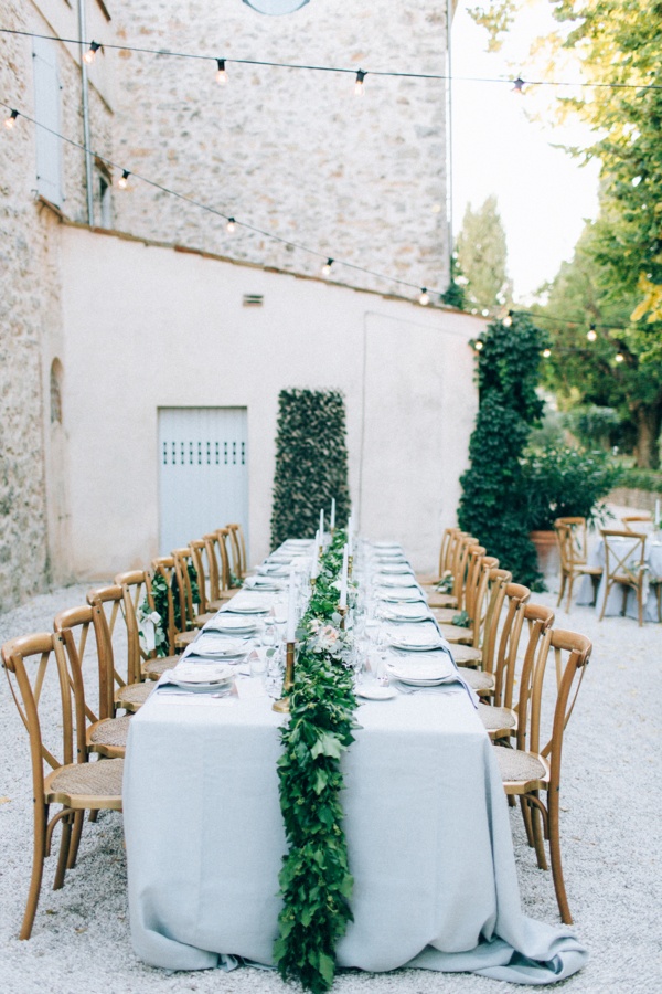 Outdoor villa wedding reception with greenery garland