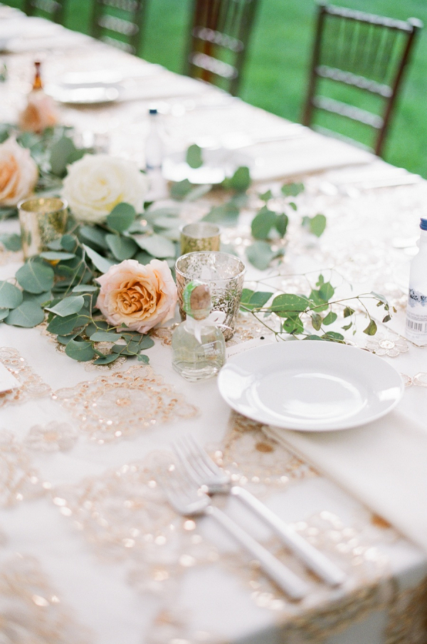 Peach, gold, and cream wedding table with sequin linens