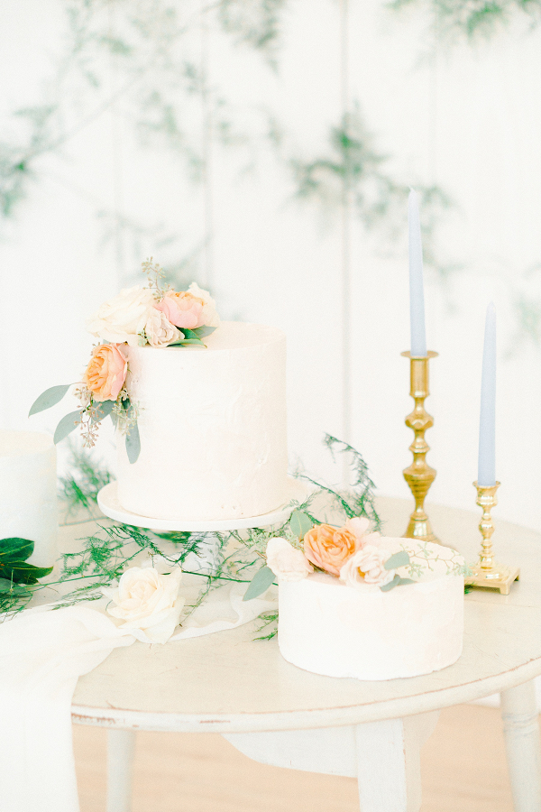 Classic white wedding cakes with peach flowers