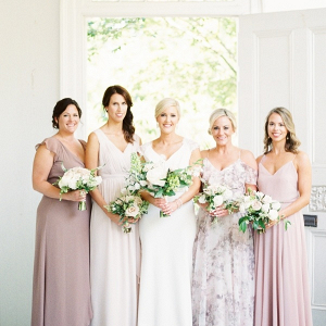 Bridesmaids in mismatched mauve dresses