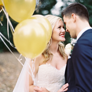 Bride and groom with balloons
