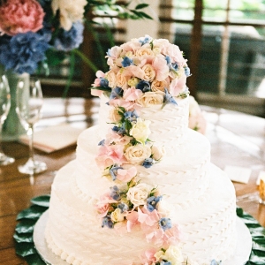 Wedding Cake with Blue and Pink Flowers