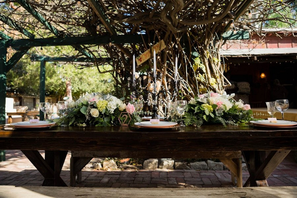 Farm table at rustic pink wedding