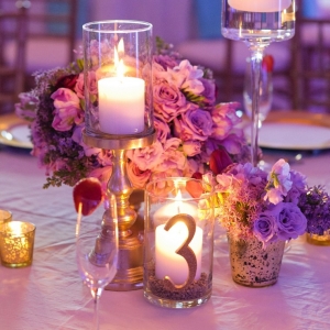 Glamorous purple centerpiece with candles