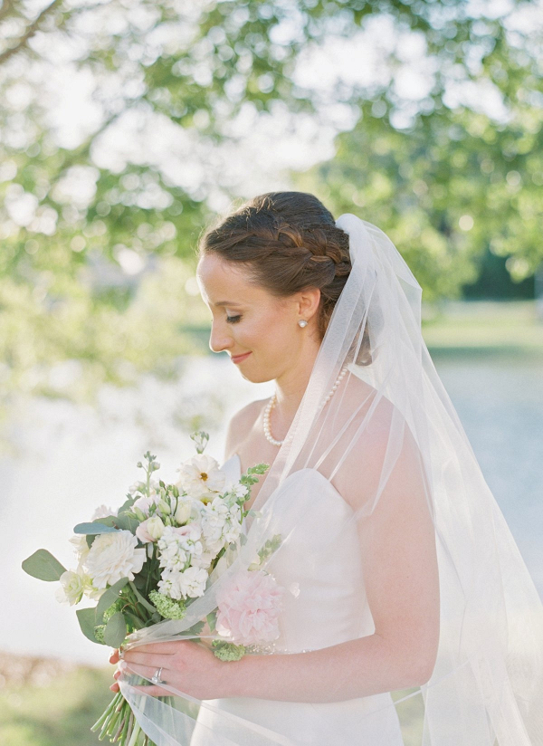 Bride with braided updo and cathedral veil