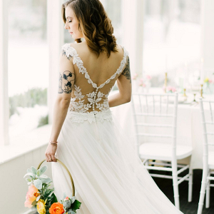 Bride in illusion lace back wedding dress