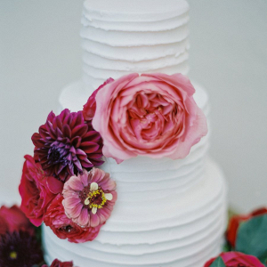 Floral covered white wedding cake