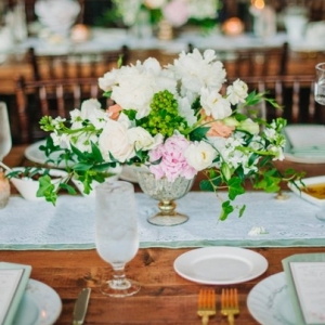 Pink and white centerpiece with greenery accents