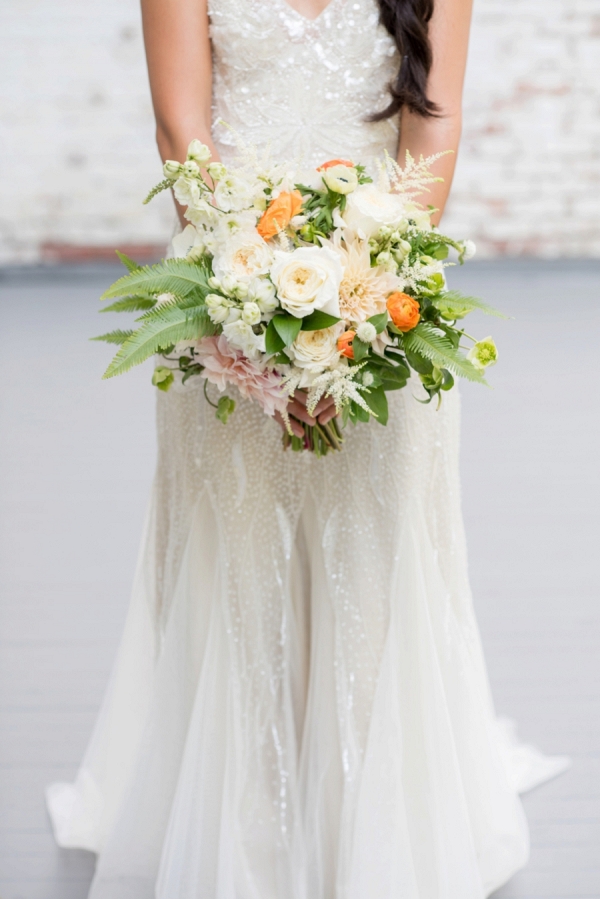 White and orange bouquet with greenery