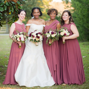 Bridesmaids in mauve red gowns