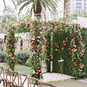 Floral covered ceremony arbor