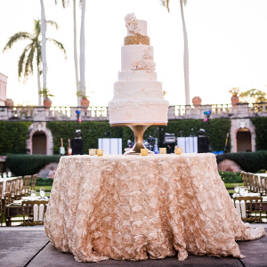 Tall white and gold wedding cake