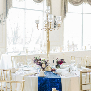 Elegant reception table with candelabra and sequin runner