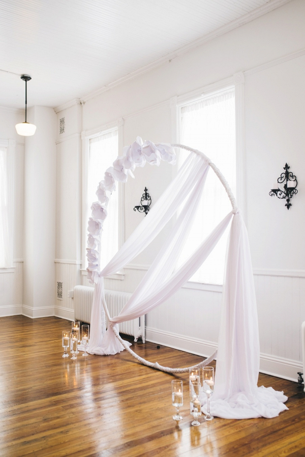Draping and paper flower ceremony arch
