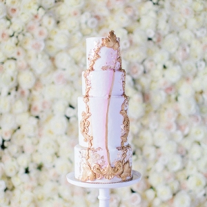 Tall pink and gold wedding cake on Every Last Detail