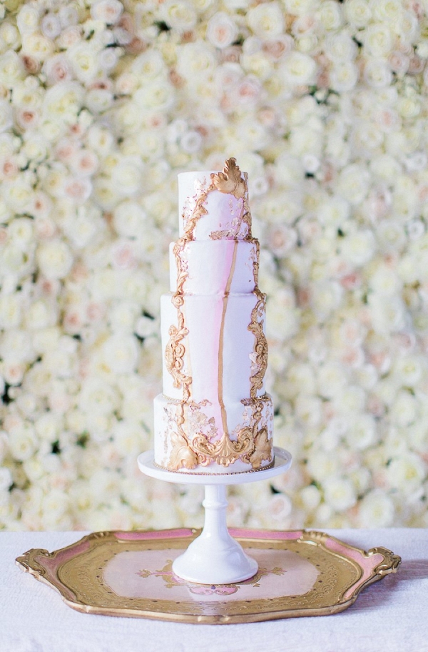 Tall pink and gold wedding cake on Every Last Detail