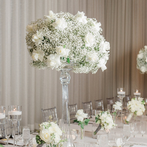 Tall rose and baby's breath wedding centerpiece