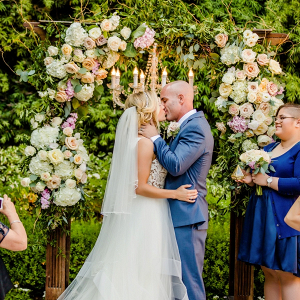 Flower covered ceremony arch