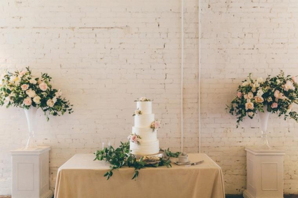 Classic white wedding cake with fresh flowers