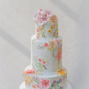 Peach and pink flower painted wedding cake